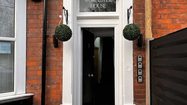 A building entrance with a sign reading "WORCESTER HOUSE." - Apartment No.3 @Worcester House & Free Parking (Worcester)