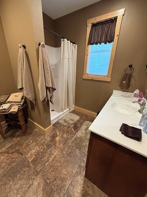 Shower, hair dryer, towels, soap