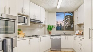 Fridge, microwave, oven, stovetop - Beachside Bliss - Waterfront apartment (Port Macquarie)