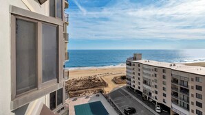 A high-rise building with a view of the beach and ocean. - 9400 Building #1106 (Ocean City)