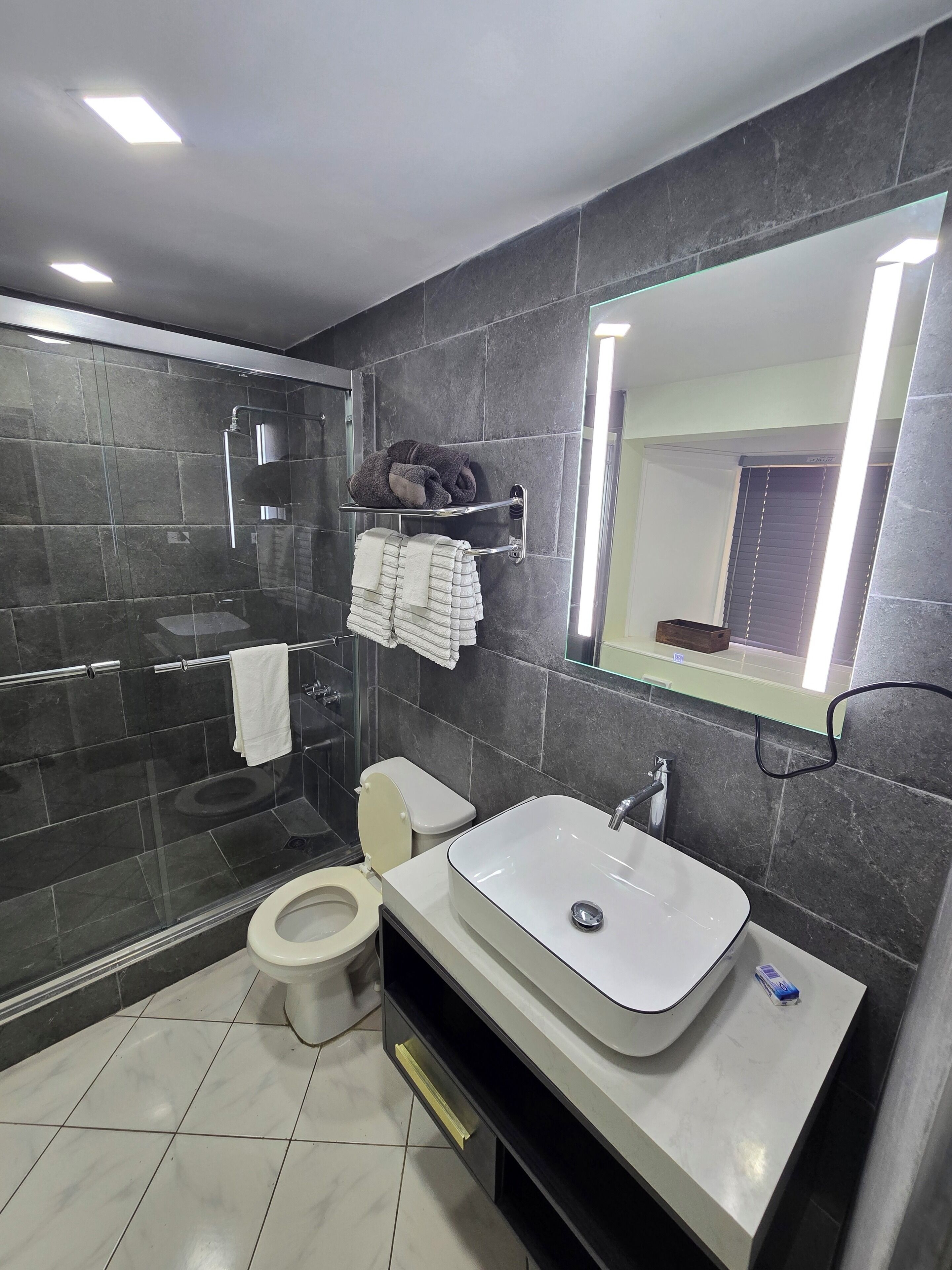 Shower, hair dryer, towels, soap