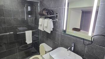 Shower, hair dryer, towels, soap