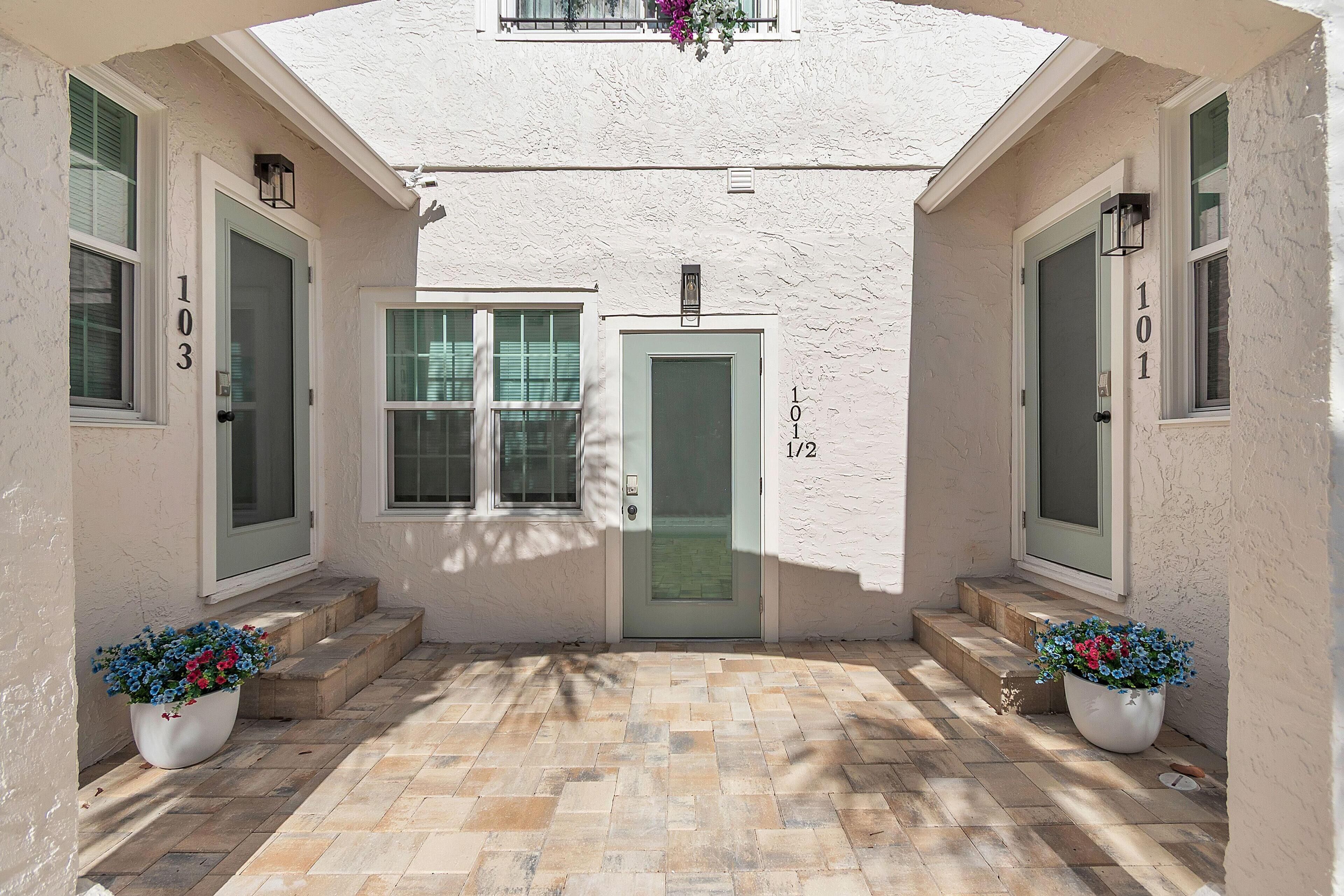 A building entrance with two doors, each marked with a number.