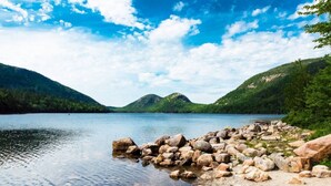 A calm lake surrounded by rocky shores and forested hills. - Private Downtown Bar Harbor Four-Apartment Home (Bar Harbor)