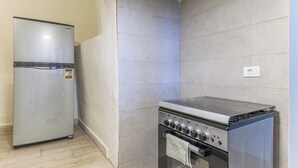 A kitchen with a refrigerator and a stove. - Daya 2BR Apartment In Batroun (Batroun)
