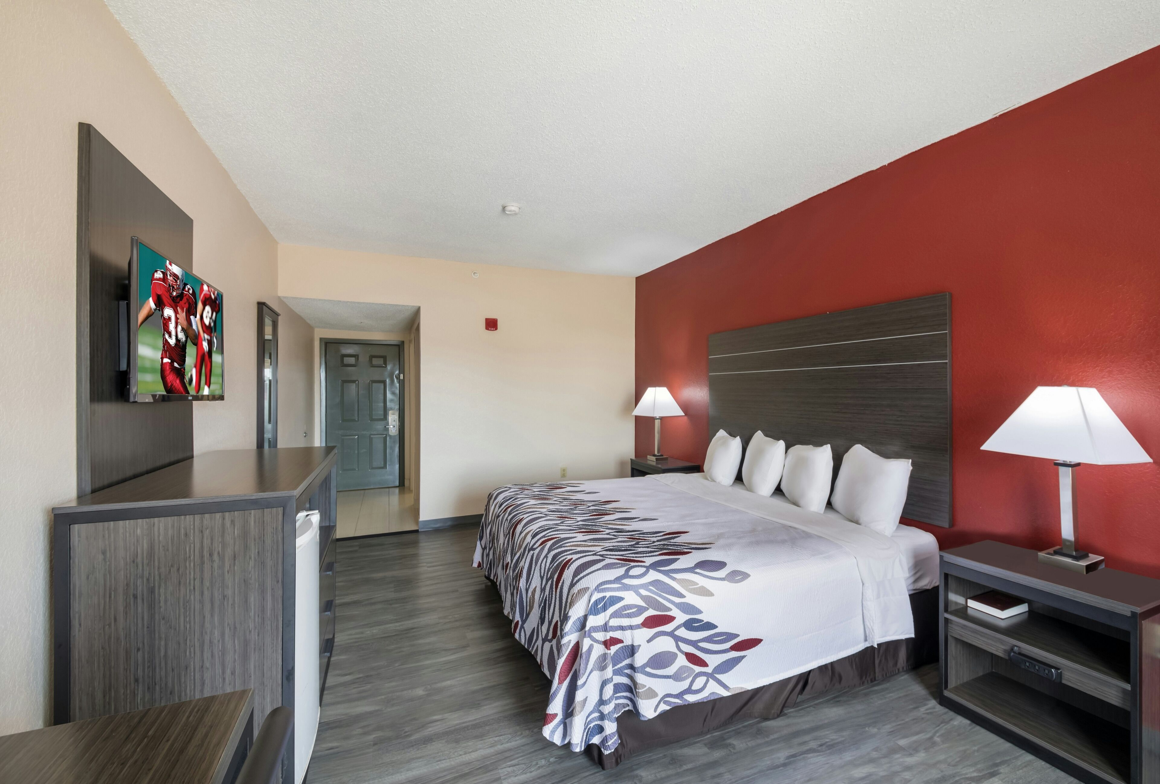 Unwind in a crisp king bed with streaming-ready TV.