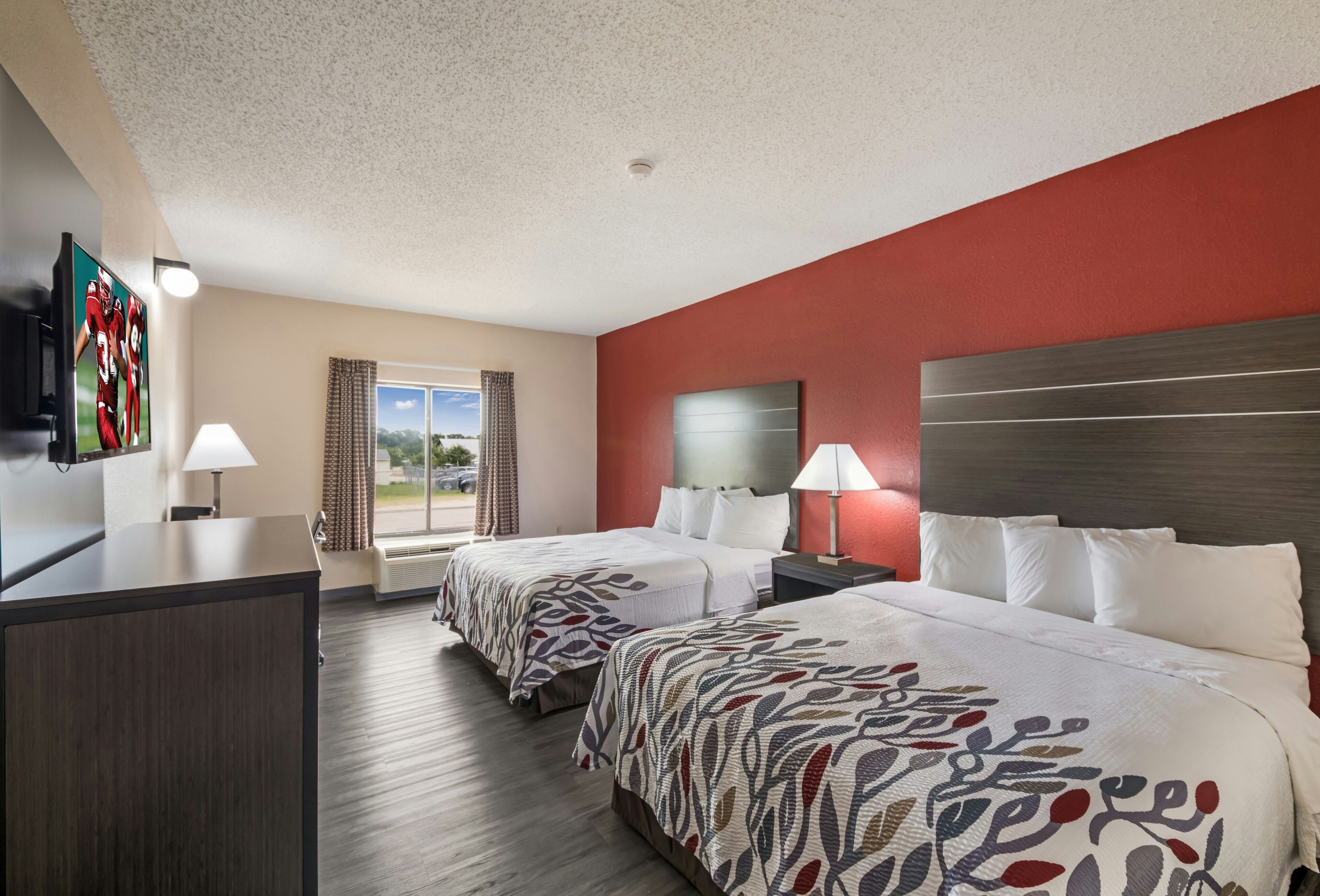 Recharge together in a spacious two-bed room with natural light.