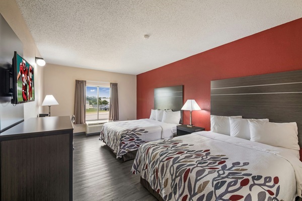 Recharge together in a spacious two-bed room with natural light.