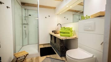 Shower, hair dryer, towels, soap