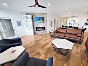 TV, fireplace - Sunset Shores | 4BR Lake Escape | Family Friendly (Arnolds Park)