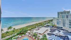 A resort with a beach view, a pool area, and a large building with multiple floors. - Luxury Oceanview 1BR 1.5BA with Grand Balcony 1403 (Miami)