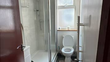 Shower, hair dryer, towels, toilet paper