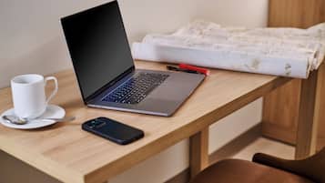 Desk, blackout drapes, iron/ironing board (on request), cribs (free)