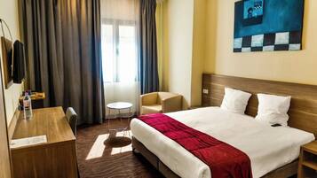 Standard Double or Twin Room | In-room safe, desk, laptop workspace, blackout drapes