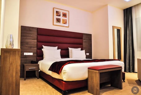 Standard Double or Twin Room | In-room safe, desk, laptop workspace, blackout drapes