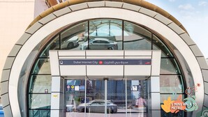 A modern building with a curved entrance and glass facade, labeled "Dubai Internet City." - Beautiful Partition Room in Tecom (Dubai)