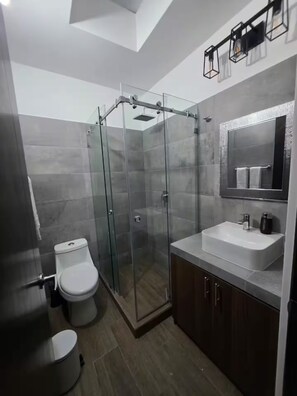 Shower, towels, soap, toilet paper