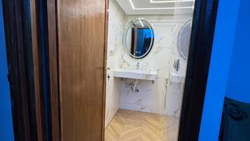 Shower, hair dryer, towels, toilet paper