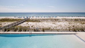 A pool with a view of the beach and ocean. - Blu 306 - The Gulf Jewel (Fort Walton Beach)
