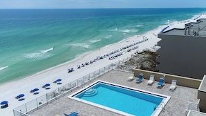 A rooftop pool with a view of the beach and ocean. - Gulfside 401 - Sunny Side Up (Fort Walton Beach)