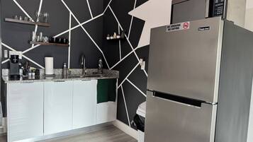 Fridge, microwave, stovetop, coffee/tea maker