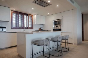 Fridge, microwave, oven, stovetop - TAU 632: High-End 3BR Penthouse + Premier Access & Golf Cart (Desarrollo Punta Mita)