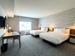 A hotel room with two beds, a desk, a chair, a TV, and a large window. - Towneplace Suites By Marriott Ridgecrest (Ridgecrest)
