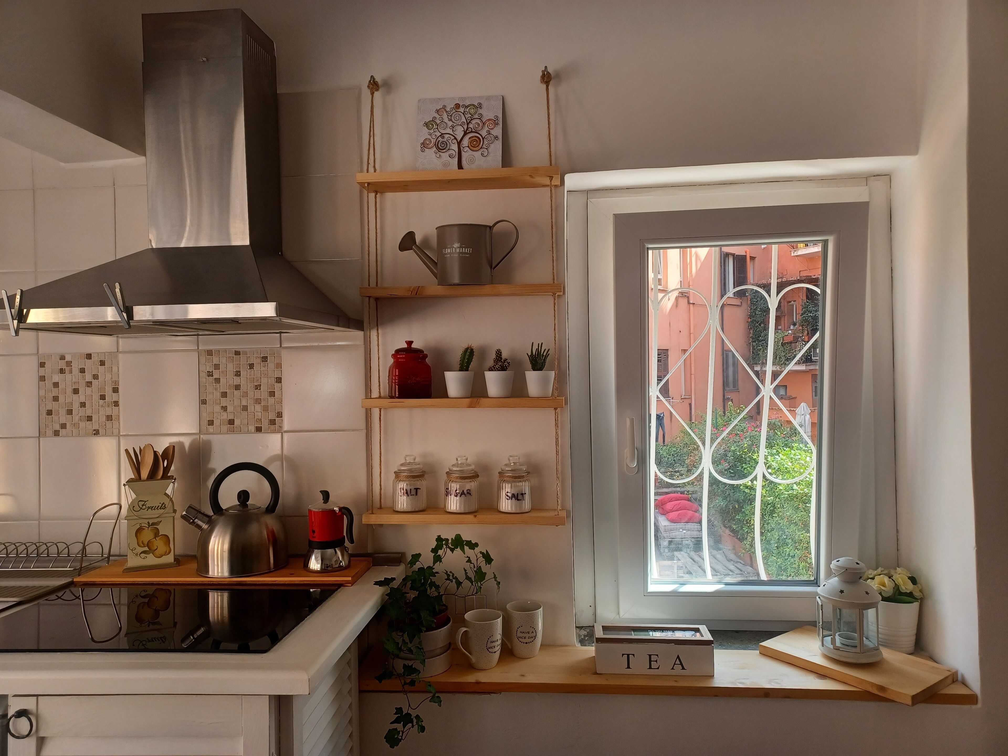 Fridge, microwave, stovetop, coffee/tea maker