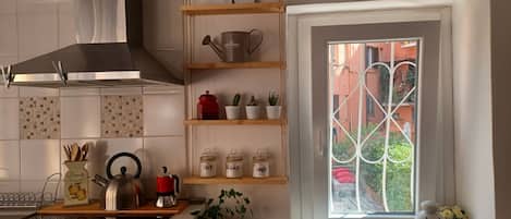 Fridge, microwave, stovetop, coffee/tea maker