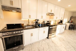 Fridge, microwave, oven, stovetop - Spacious Swan Lake Group Getaway | Sleeps 18 | Fireplace • Fire Pit • Lake Views (Swan Lake)