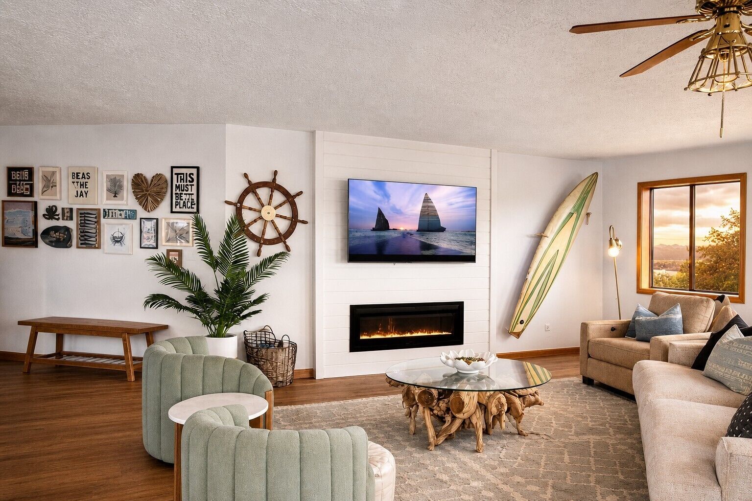 A living room with a fireplace, a television, and a sailboat decoration.