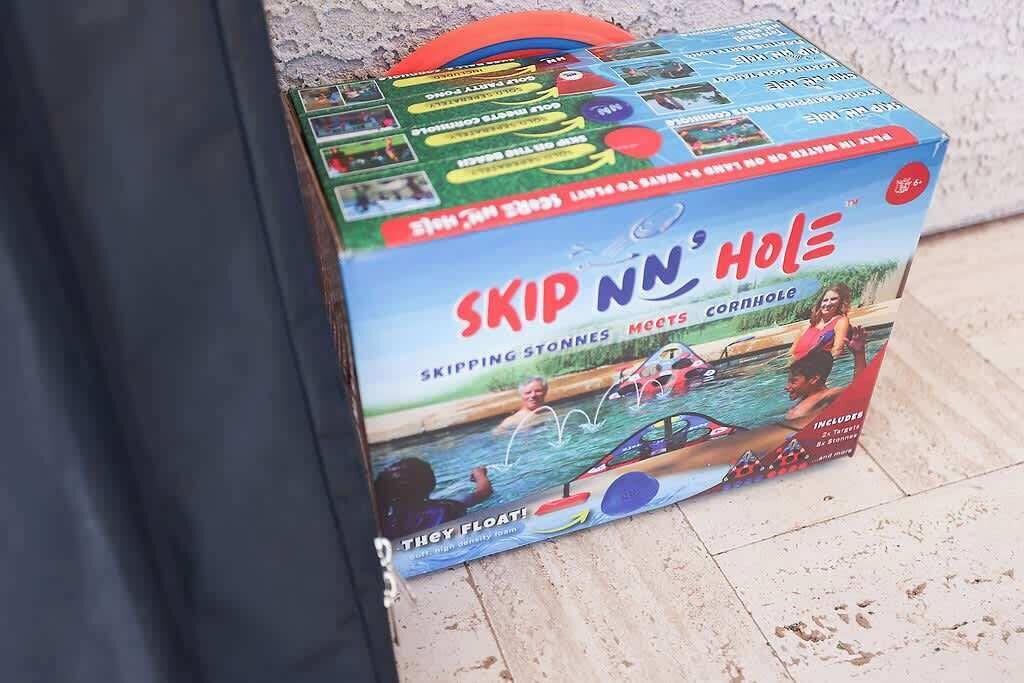 A box of 'Skip N' Hole' skipping stones.