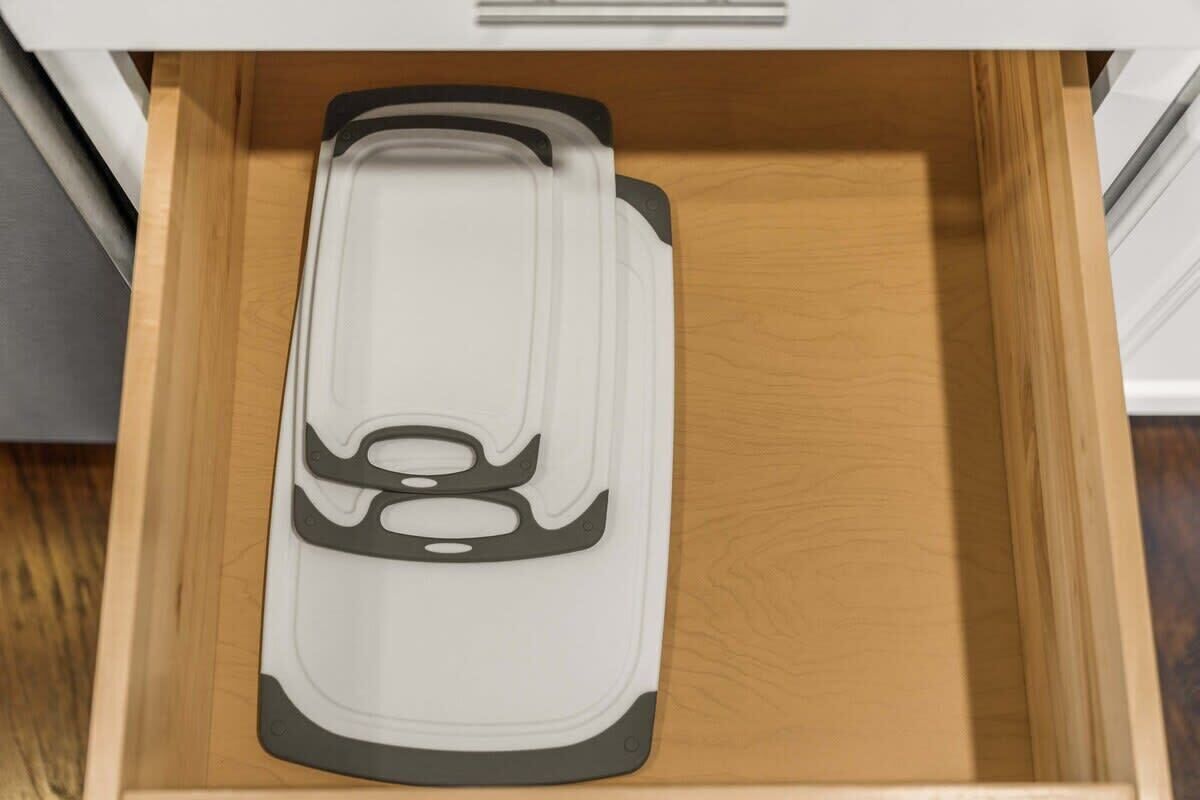 A drawer with a white and black object inside.
