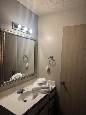 Hair dryer, towels, soap, toilet paper