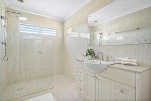 Shower, hair dryer, towels, toilet paper