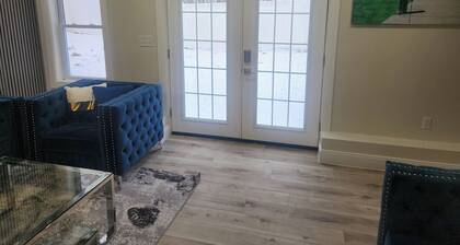 Modern Basement Suite • King Bed and 100” TV