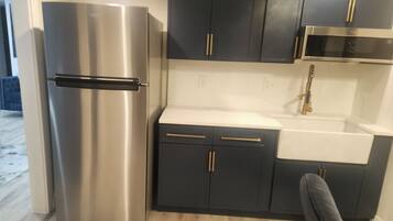 Fridge, microwave, cookware/dishes/utensils