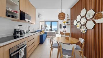 Fridge, microwave, cookware/dishes/utensils, dining tables