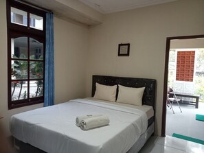 Habitación Deluxe con 1 cama matrimonial o 2 individuales, vista al patio