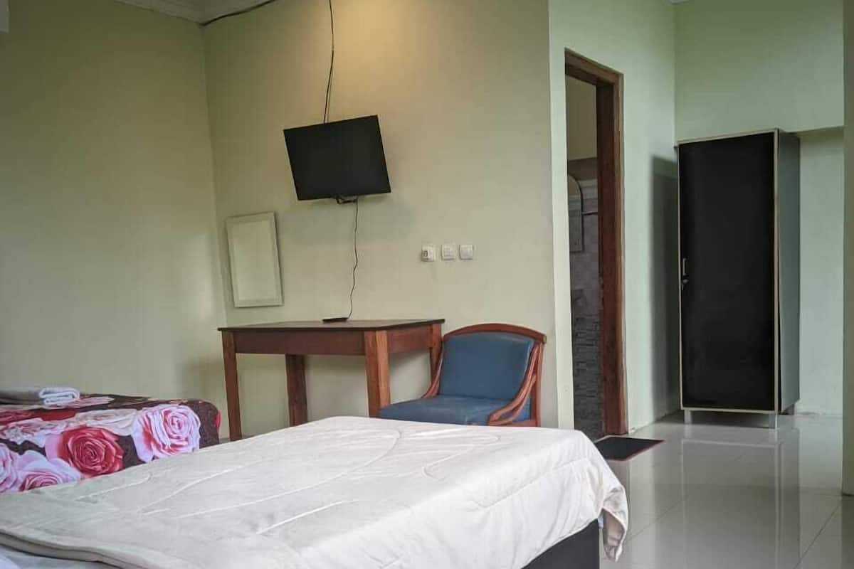 Habitación superior con 1 cama matrimonial o 2 individuales, vista al patio