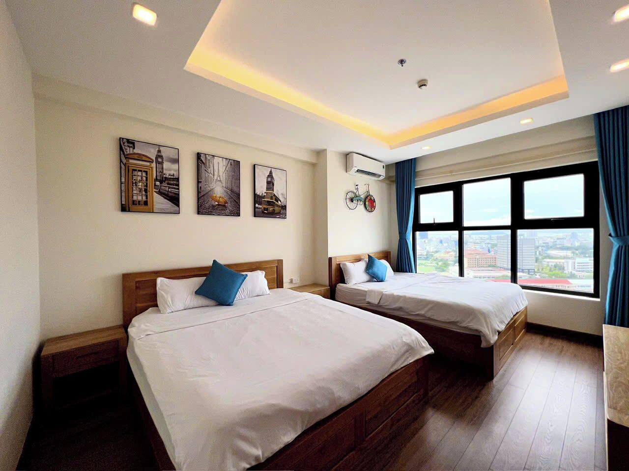 Family Apartment, 3 Bedrooms, Balcony, Beach View | Desk, laptop workspace, blackout drapes, iron/ironing board