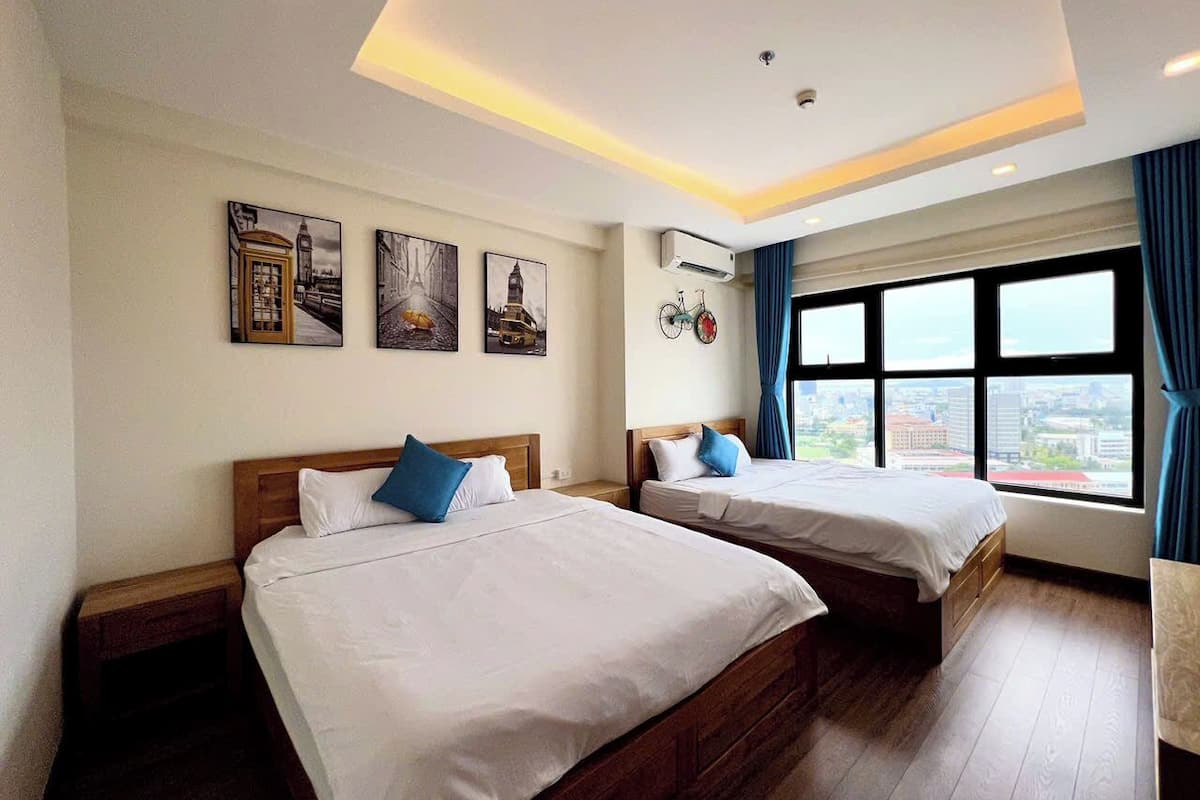 Family Apartment, 3 Bedrooms, Balcony, Beach View | Desk, laptop workspace, blackout drapes, iron/ironing board