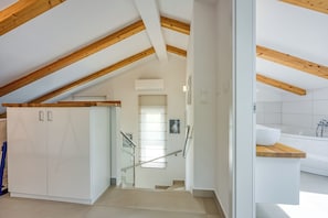 A modern kitchen with white cabinets, a wooden countertop, and a built-in oven. - Sea View Villa Maria With Pool, Pula, Croatia (Pula)