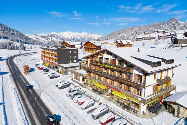 A hotel with a ski lift, surrounded by snow-covered mountains and a clear sky. - Hotel Relais Alpin Twin Room & Balcony9 327, Les Mosses, Switzerland (Les Mosses)