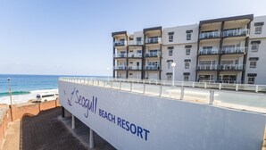 A beachfront building labeled "Seagull Beach Resort" with multiple balconies and a view of the ocean. - Coastal Retreat | Terrace | Pool | Sea Views (Margate)
