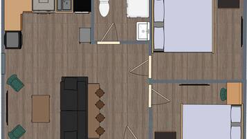 A hotel room layout with a bed, a desk, a chair, a sofa, a small table, and a TV.