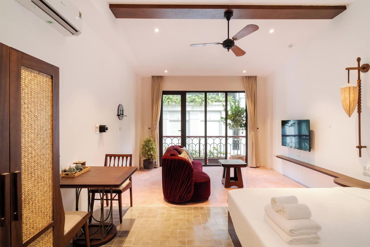 Deluxe Double Room, Balcony, City View | In-room safe, desk, laptop workspace, blackout drapes