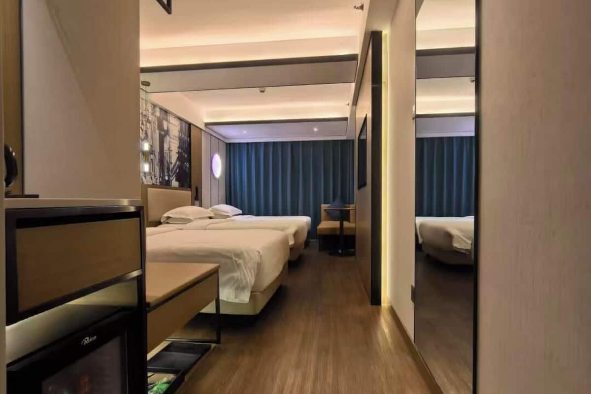 Family Triple Room | Down comforters, desk, laptop workspace, blackout drapes