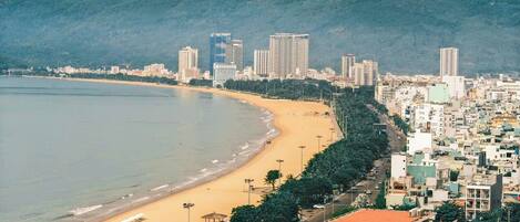 On the beach, white sand, free beach cabanas, beach shuttle