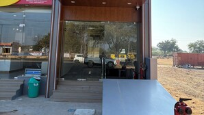 The exterior of the Bharat Inn Hotel with a clear view of the entrance and surrounding area. - Bharat Inn Hotel And Restaurant (Nakhtarana)